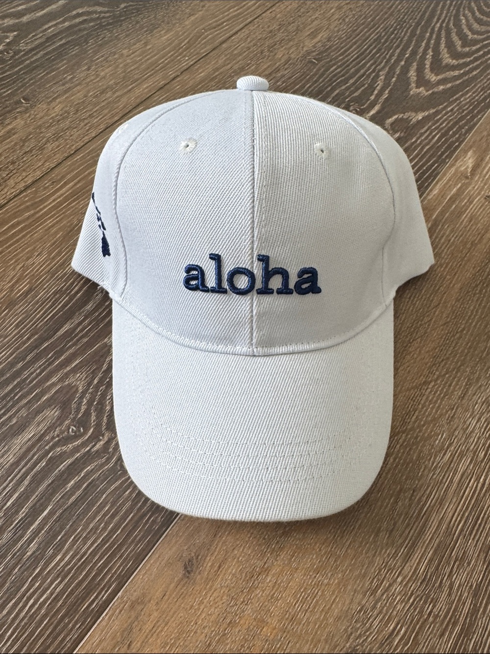 NWT White 'aloha' Embroidered Cap- Navy Lettering & Velcro back adjuster.